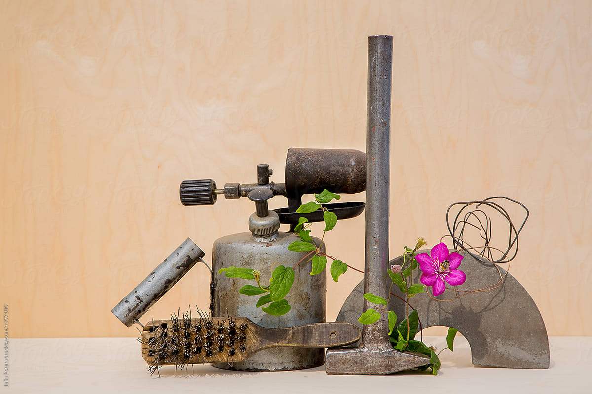 Old construction tools with flower