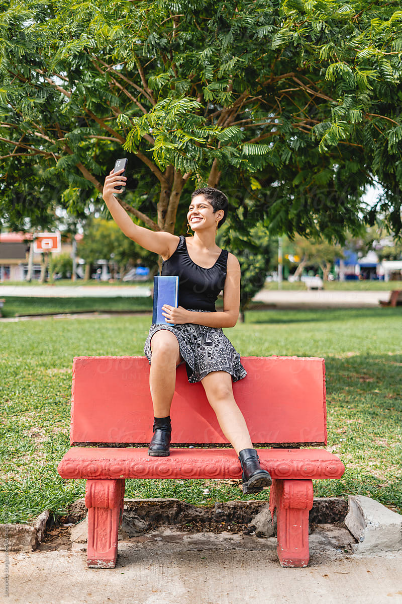 Short-haired woman taking a selfie