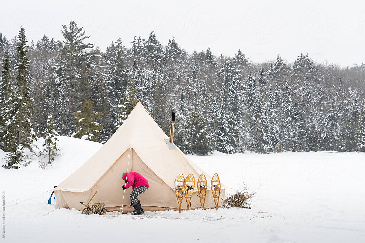 Traditional Tent Winter Campsite with Snowy Landscape