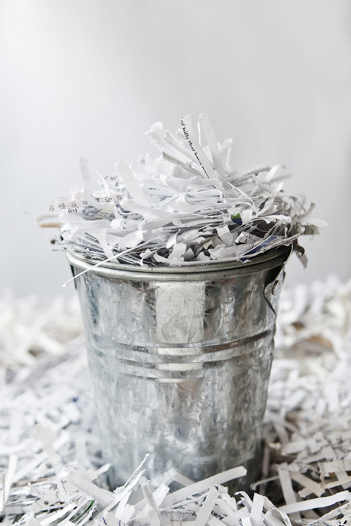 bucket full of  shredded paper pieces