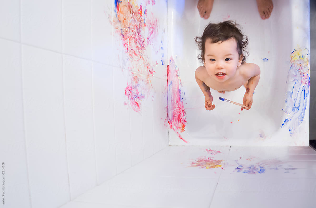 Happy toddler, painting bathroom
