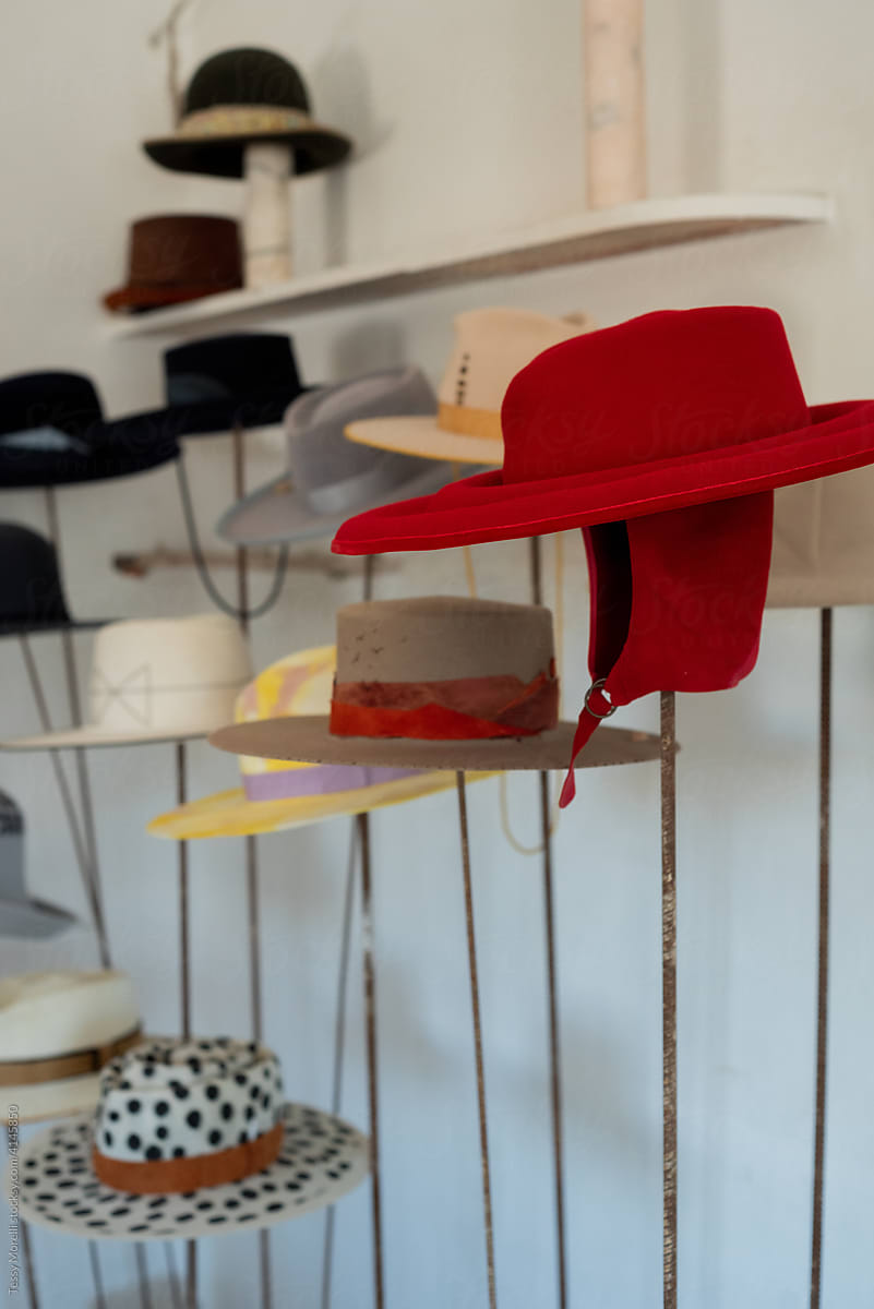 Stunning and elegant red hat displayed in the atelier
