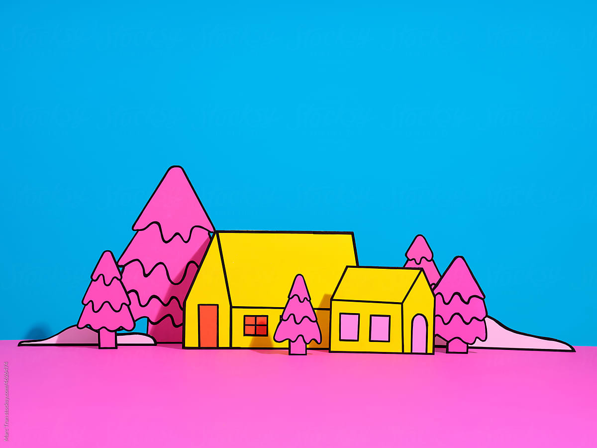 paper houses and trees on blue background