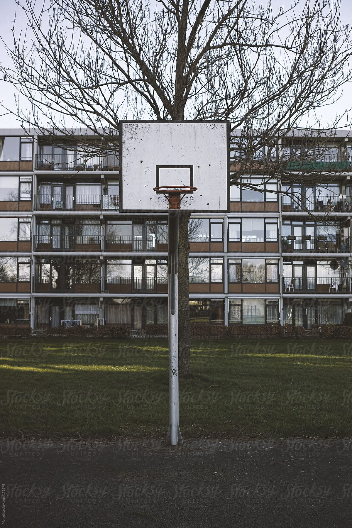Basketball goal in front of an appartment block