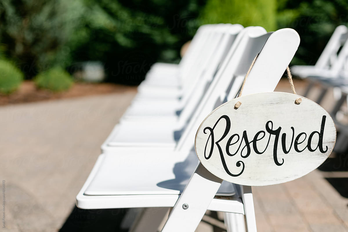 Reserved Sign Hanging off of Ceremony Chair