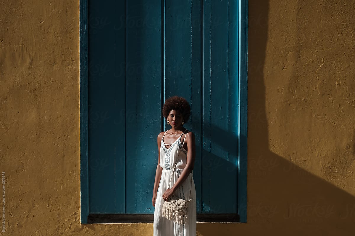 African Woman Wearing White Dress On A Sunny Day By Stocksy Contributor Brkati Krokodil