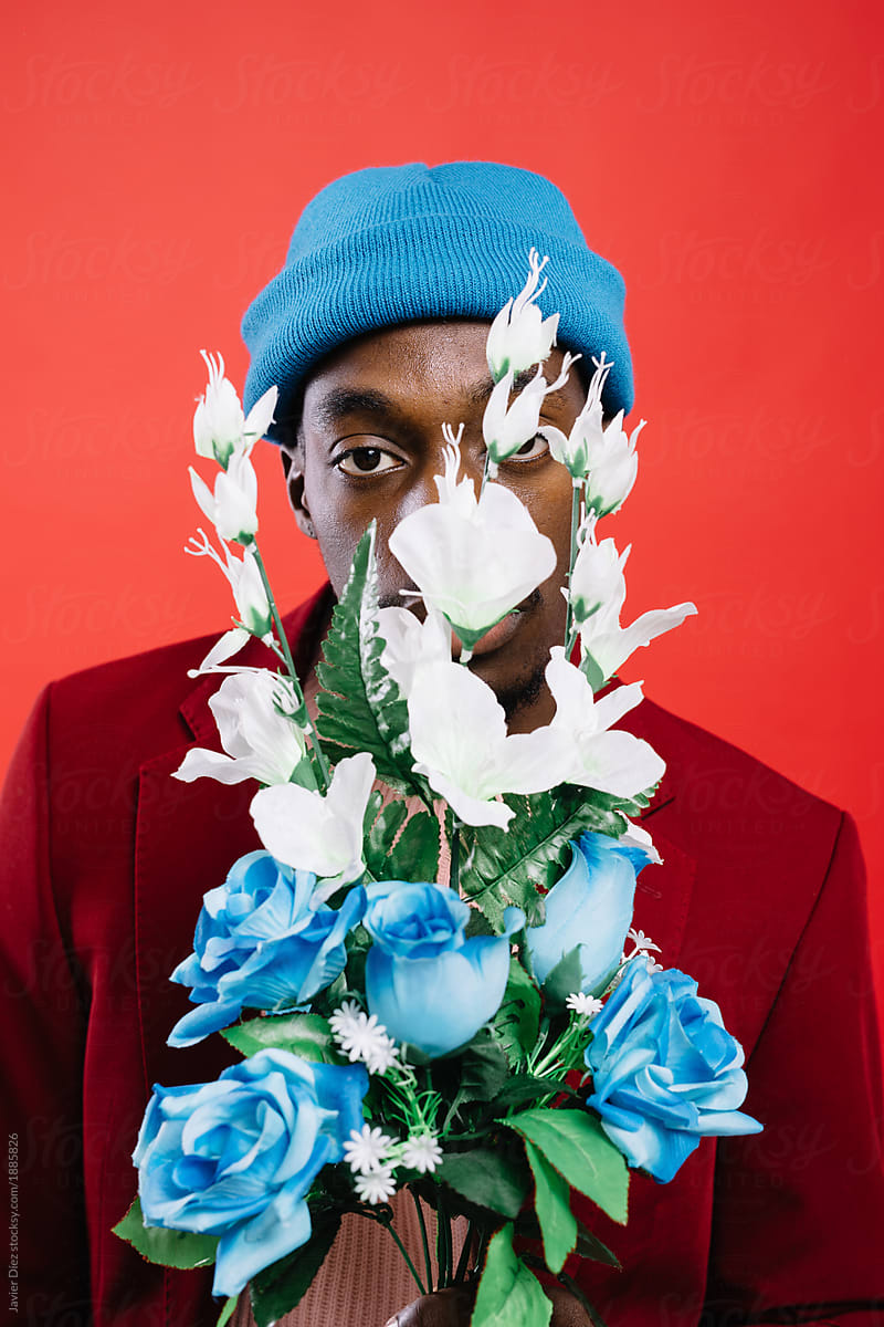 Black man in suit with flowers