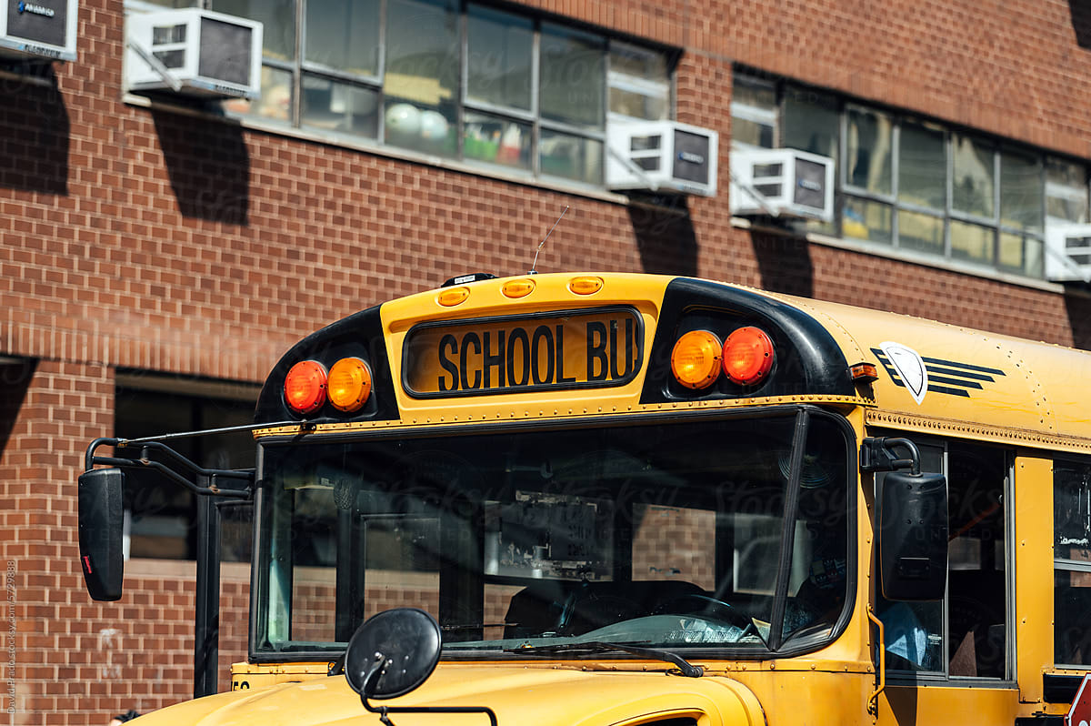 School bus outside brick building in Manhattan