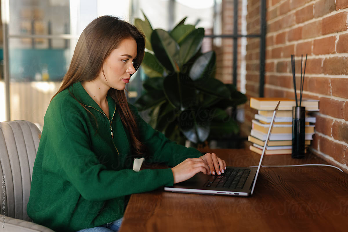 Busy girl working online in modern office