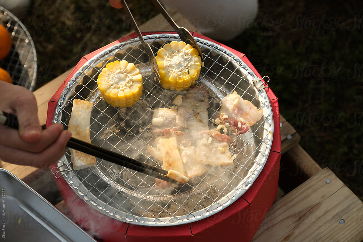 Closeup of a small oven grilling outdoors