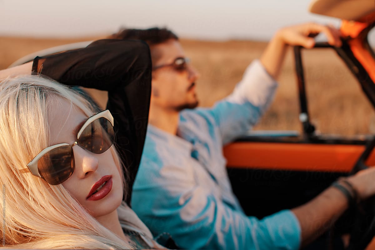 Beautiful Couple In A Convertible Car On A Road Trip By Stocksy Contributor Alexandra Bergam 