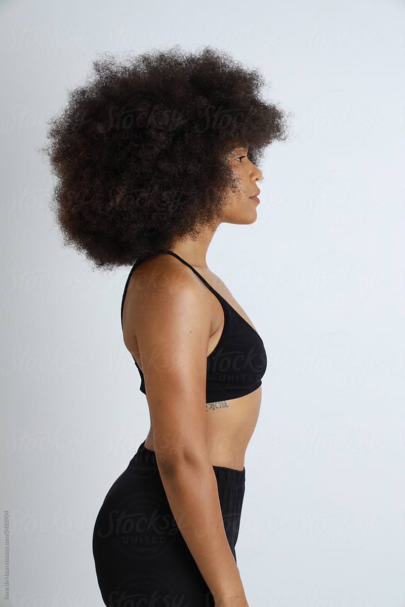 black woman with afro, in profile
