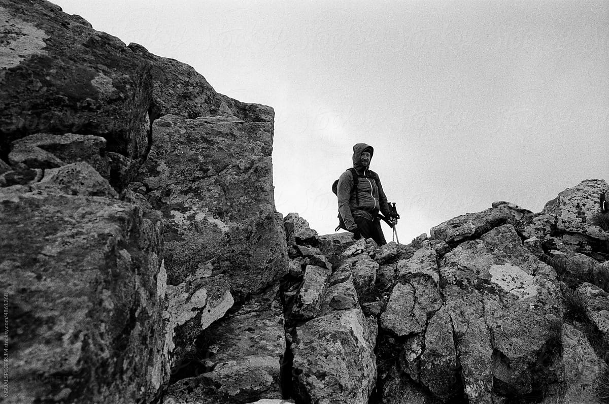 Environmental Portrait of Male Hiker on Mountain Top