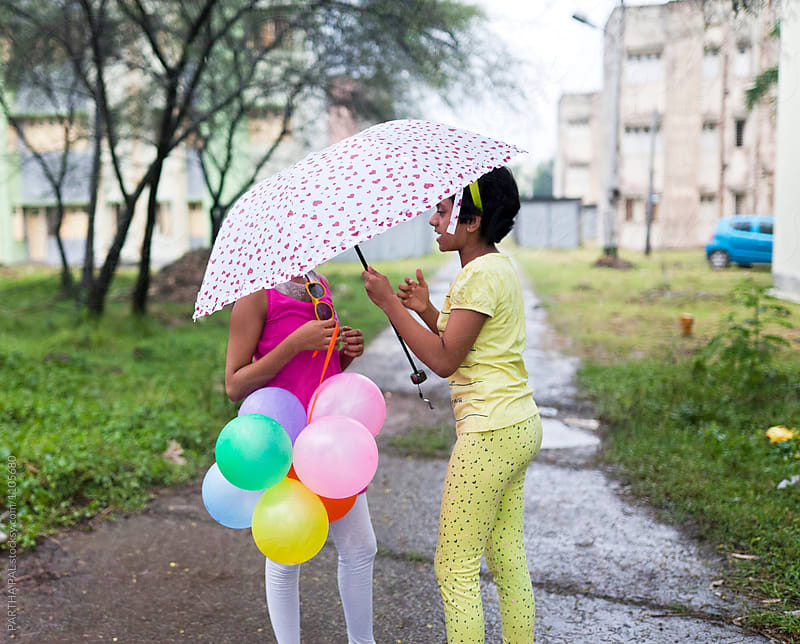 Teenage Girls making fun with Ballons in Hand