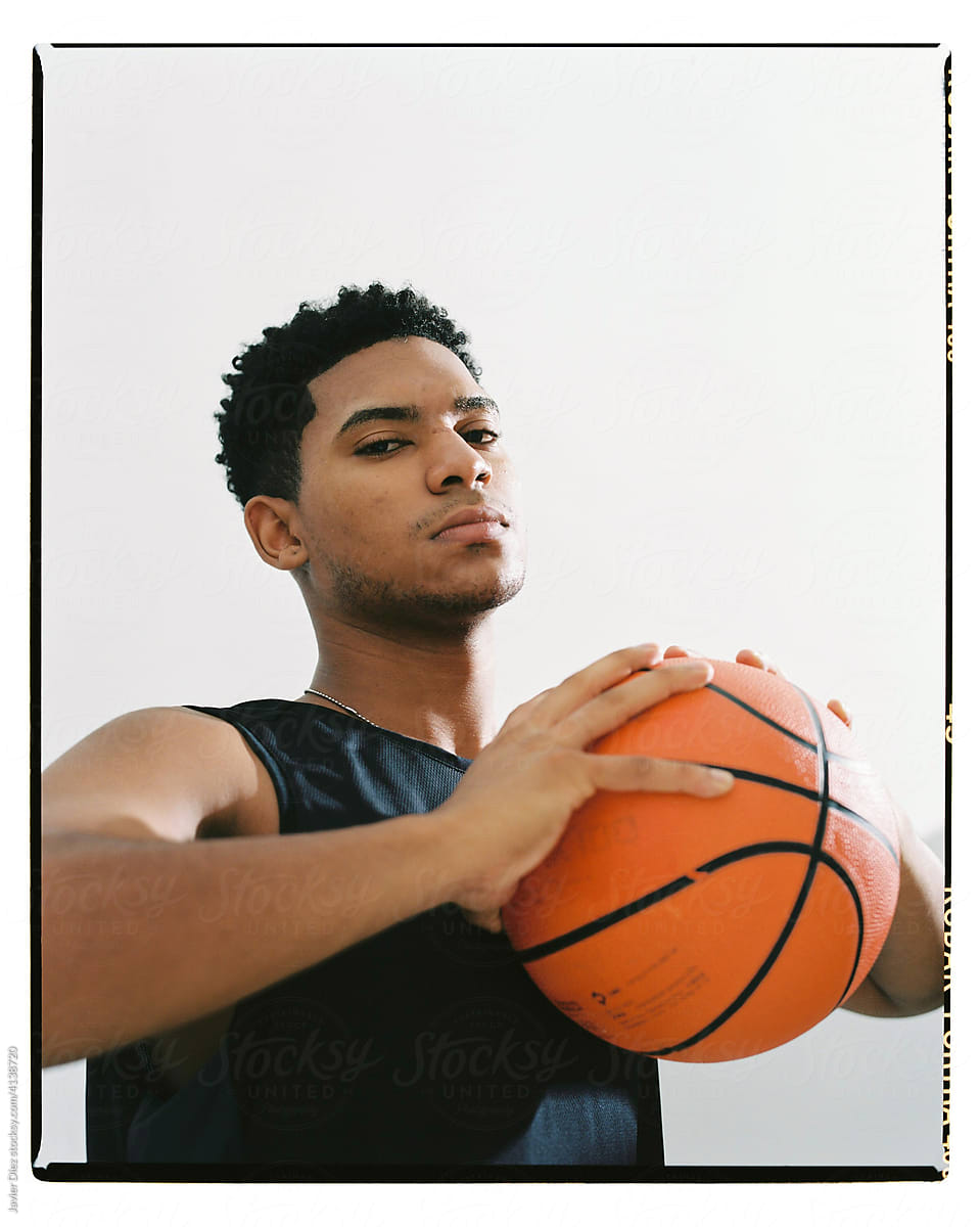 Serious black basketball player in studio