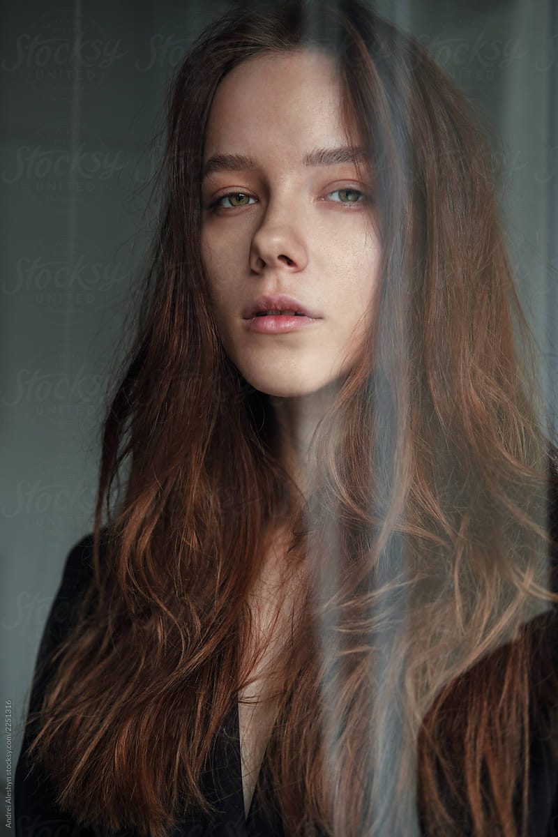 Portrait Of A Sensual Girl Behind The Glass By Stocksy Contributor Andrei Aleshyn Stocksy