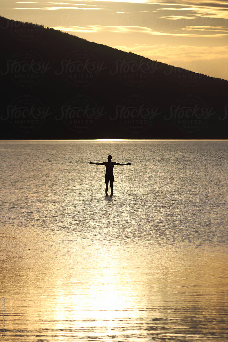 Young man walking on water