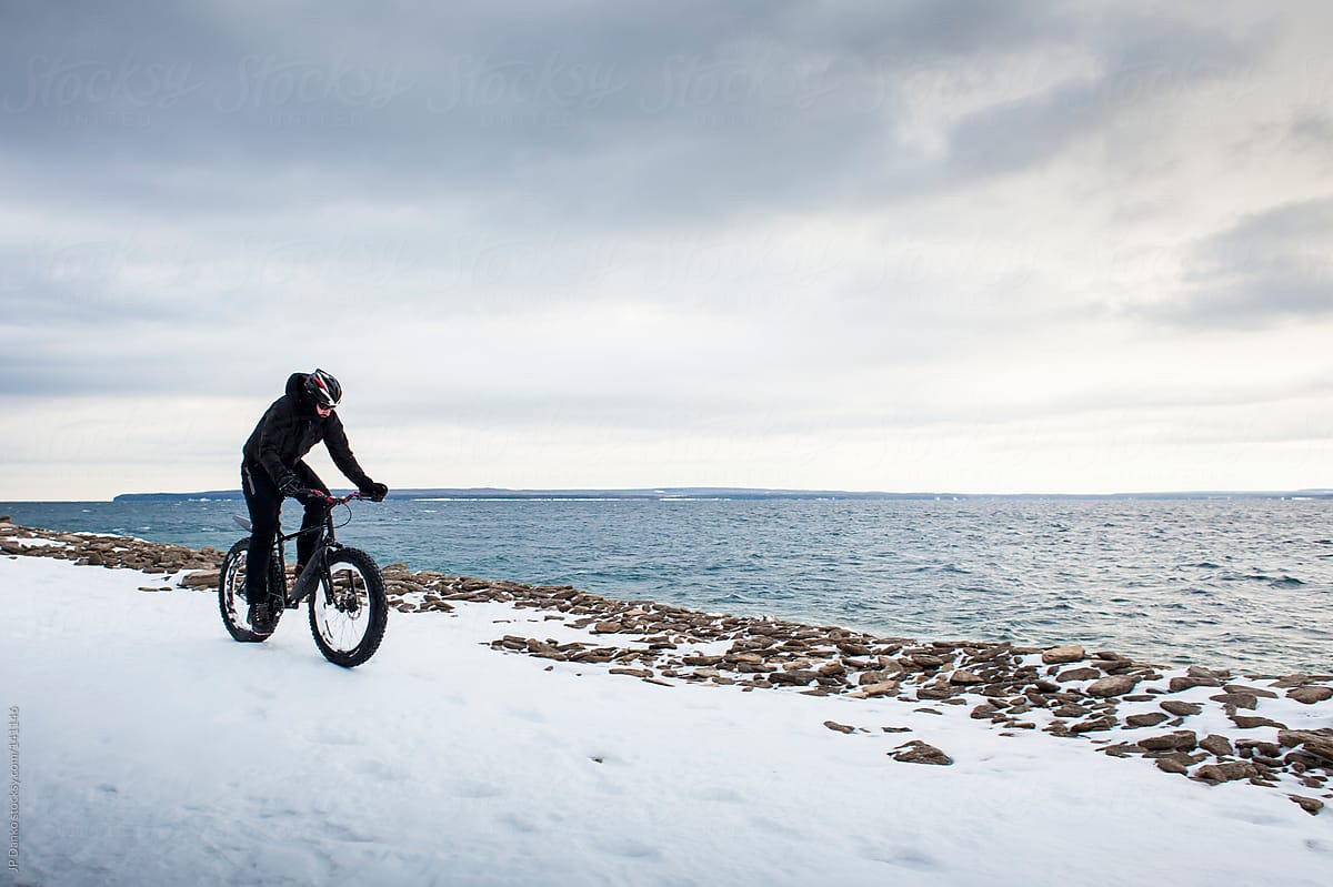 Extreme Sport Winter Mountain Biking Man Riding Bike In Snow