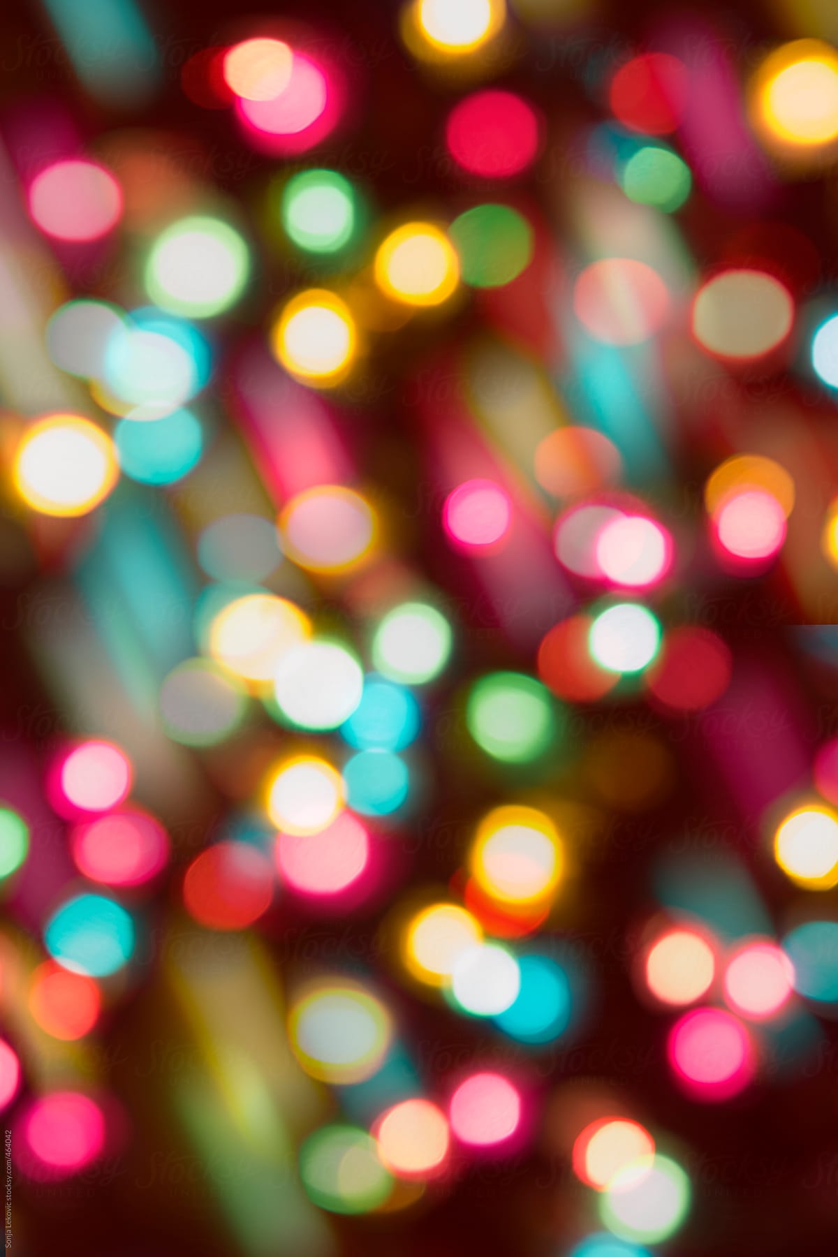 colorful party lights in blur background by Sonja Lekovic - Stocksy United