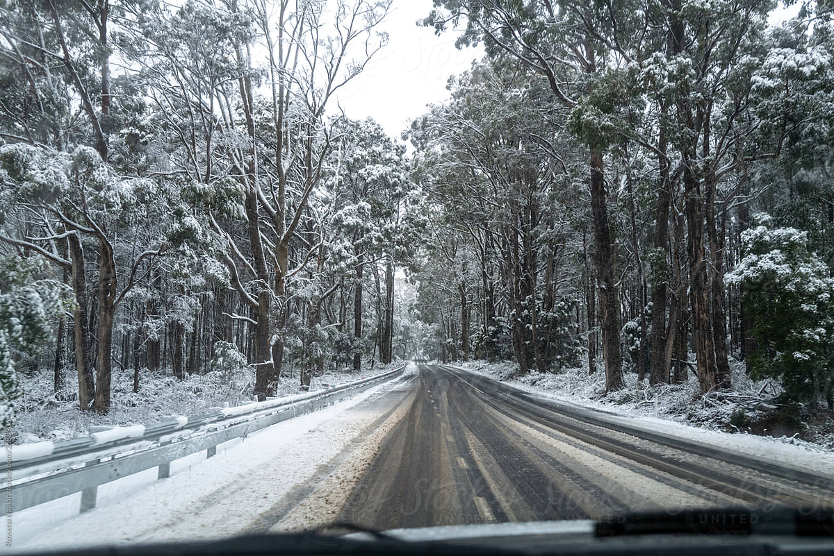 POV of driving on snowy and slushy road in country Australia