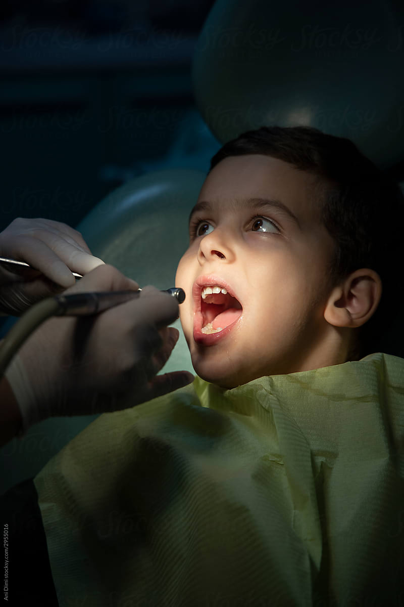 Dentist Working On Child Teeth