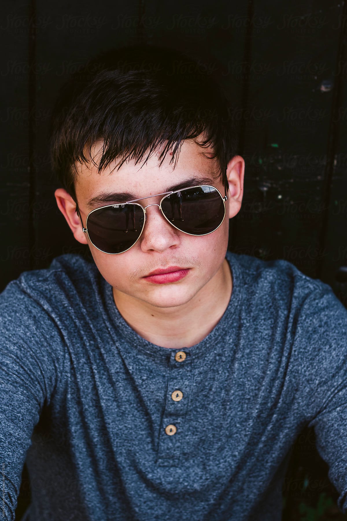 Teenage Boy In Aviator Sunglasses by Stocksy Contributor Helen Rushbrook  - Stocksy