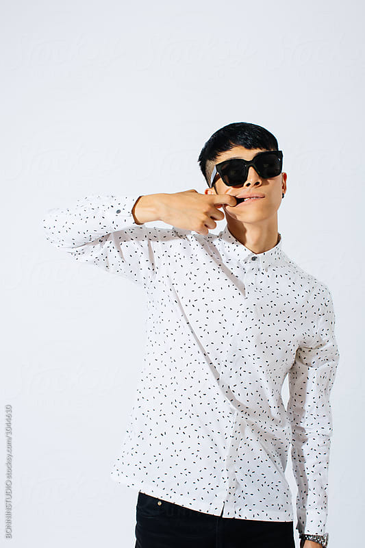 Portrait of a stylish asian man over white background.