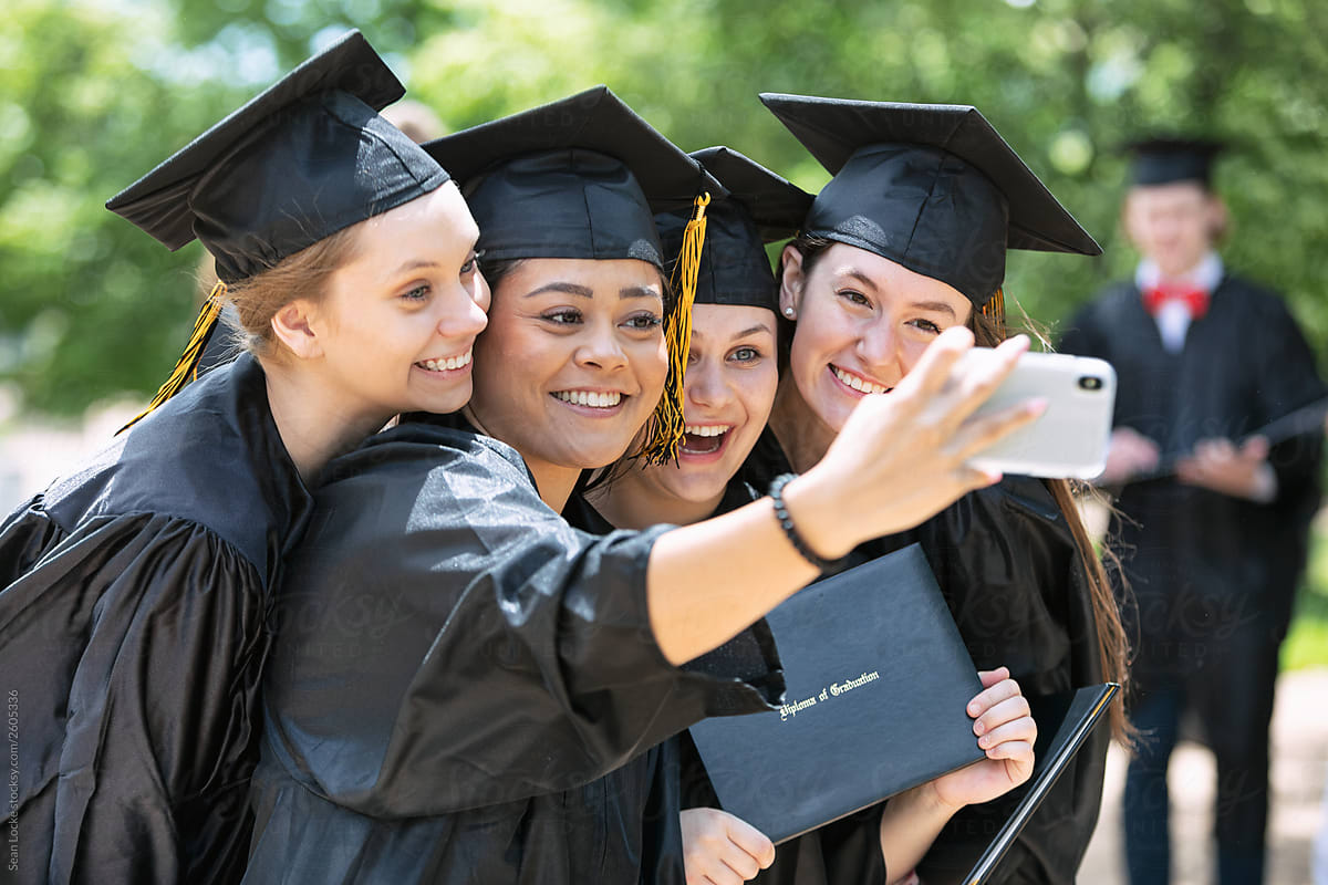 Grad: Excited Friends Take Selfie With Diploma
