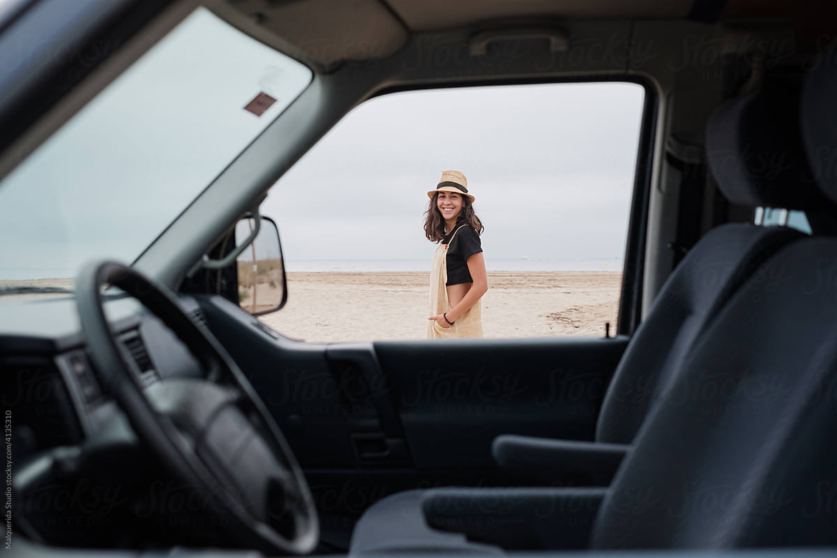 Portrait of a woman through car window