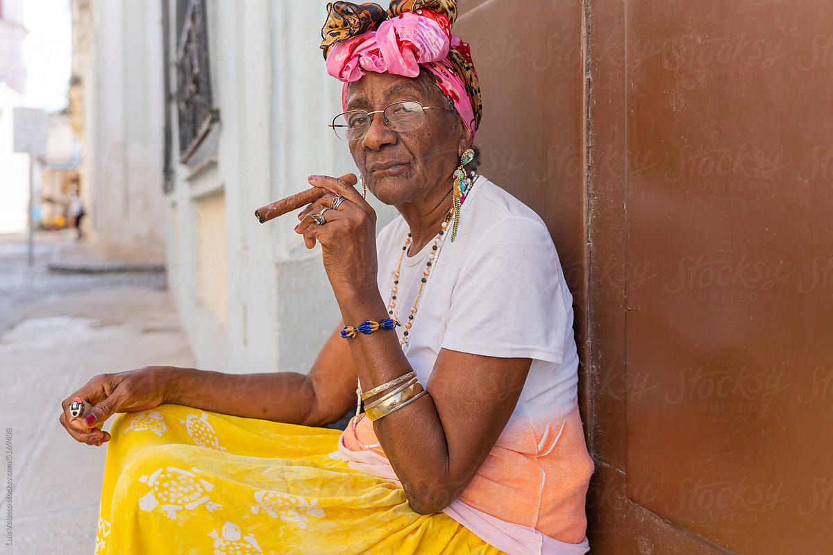 Black Woman Smoking A Cigar In Cuba.