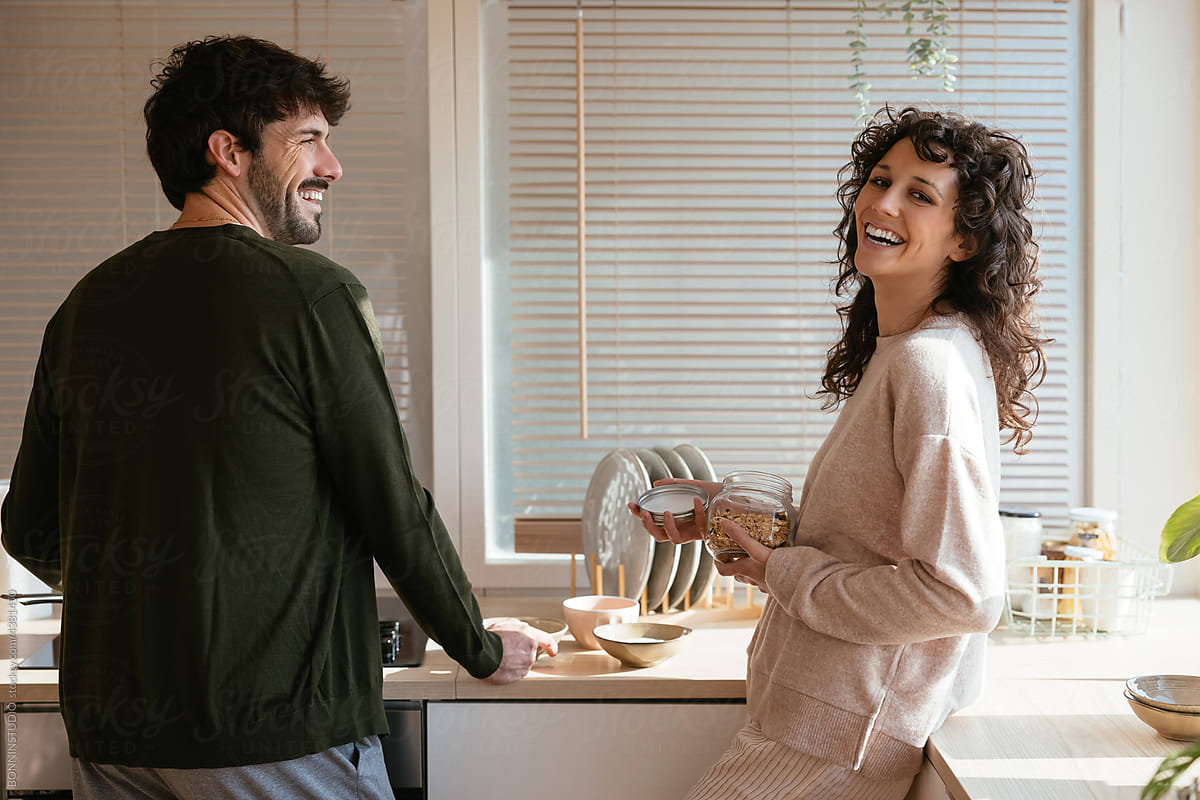 Loving couple cooking healthy breakfast together