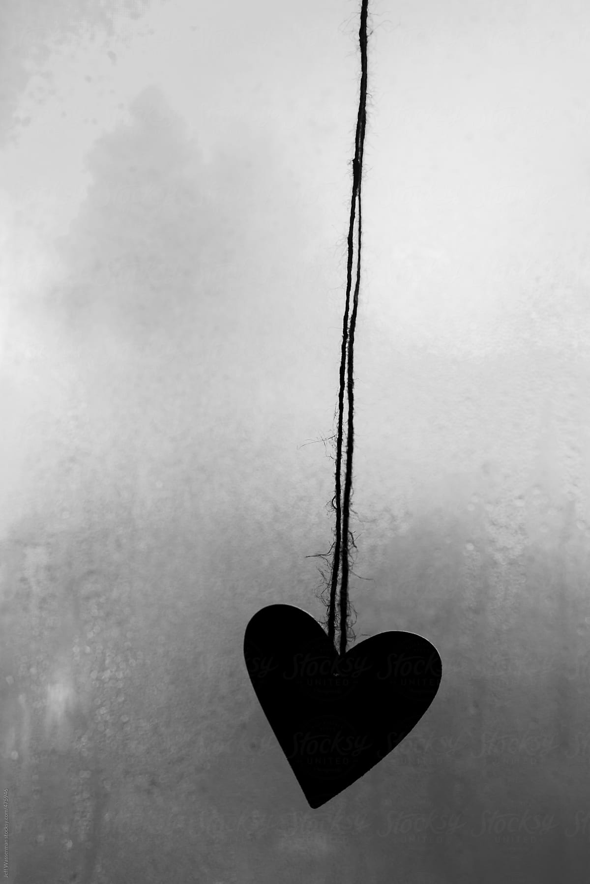 Heart  Silhouetted Against a Frosted Window