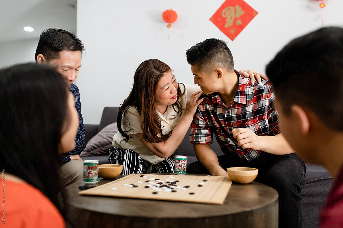 Chinese Family Playing Board Game During Chinese New Year