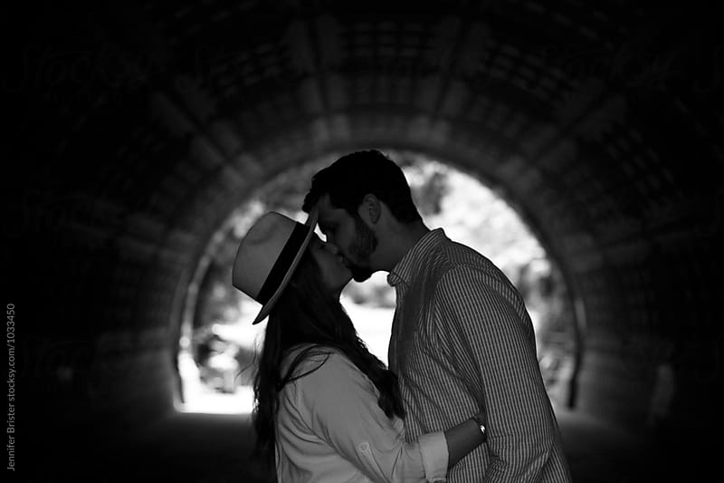 Couple kissing in tunnel