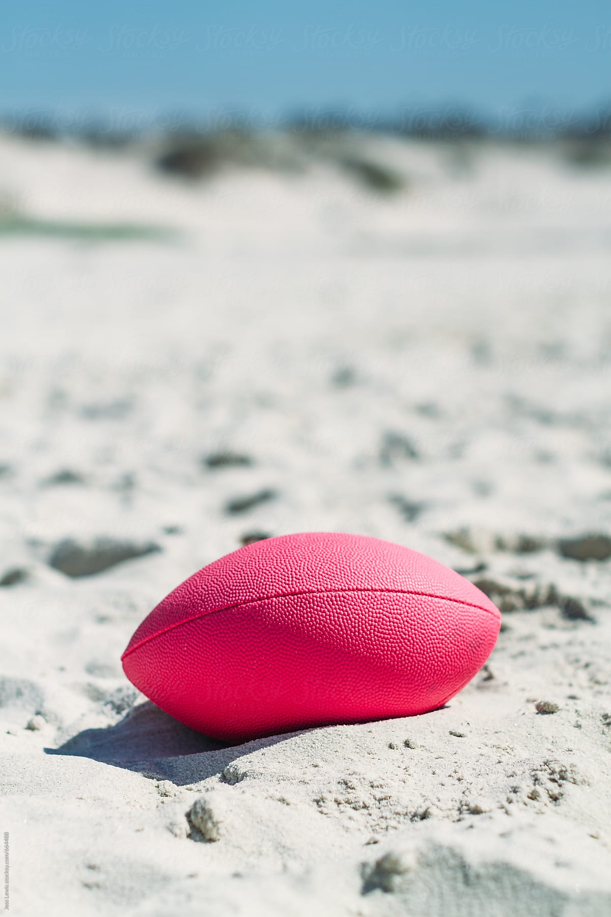 pink football in the sand