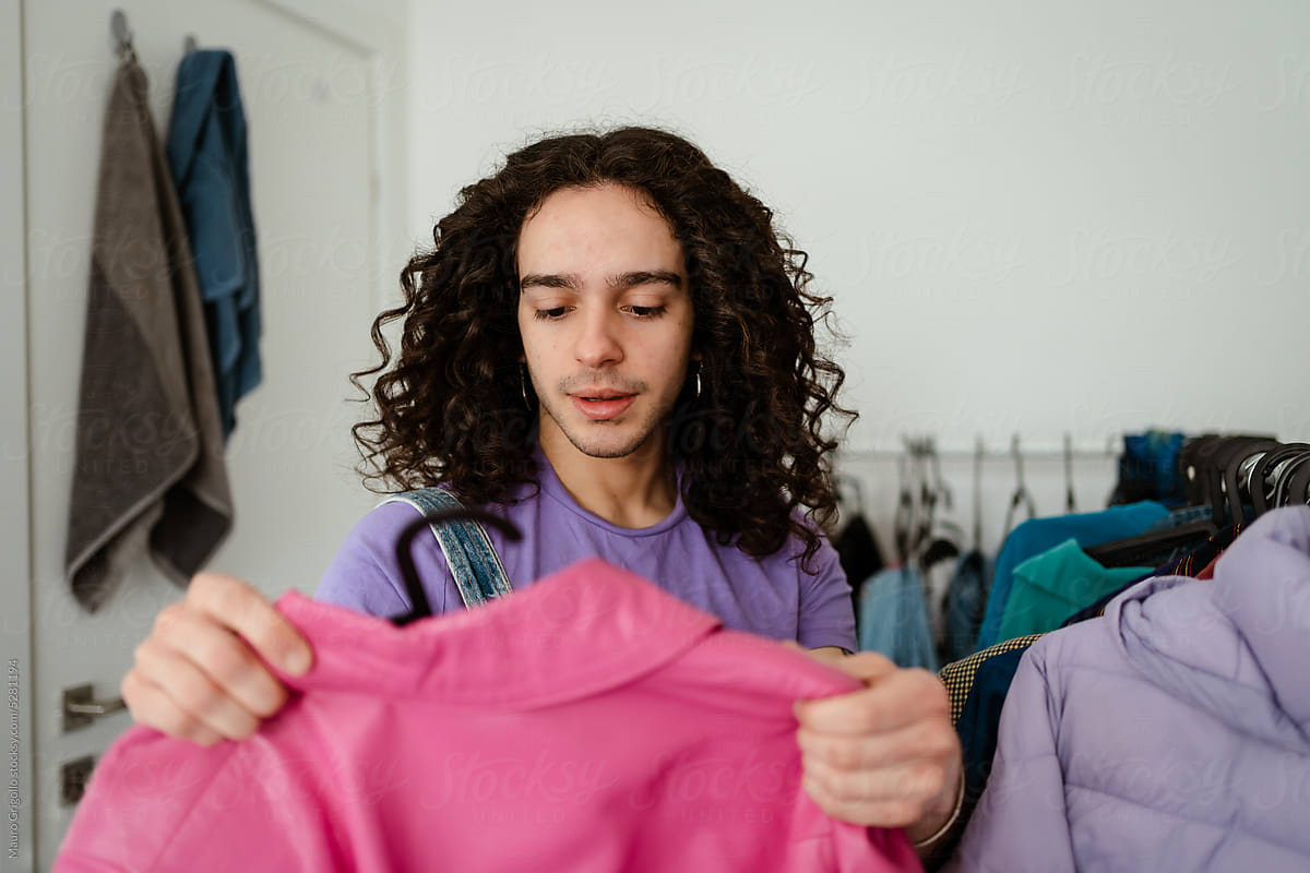 Man searching for clothes in the wardrobe