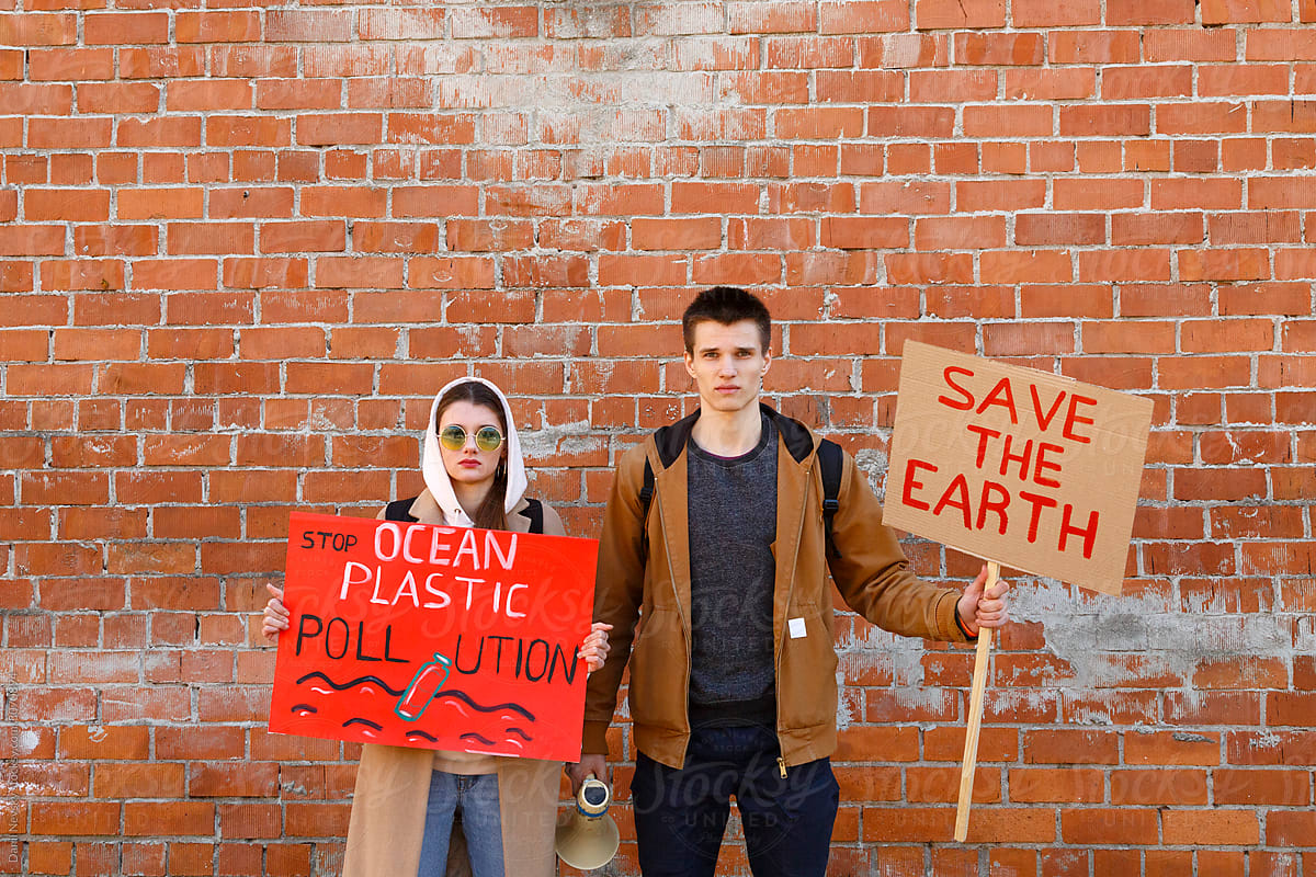 Young couple protesting against environmental changes