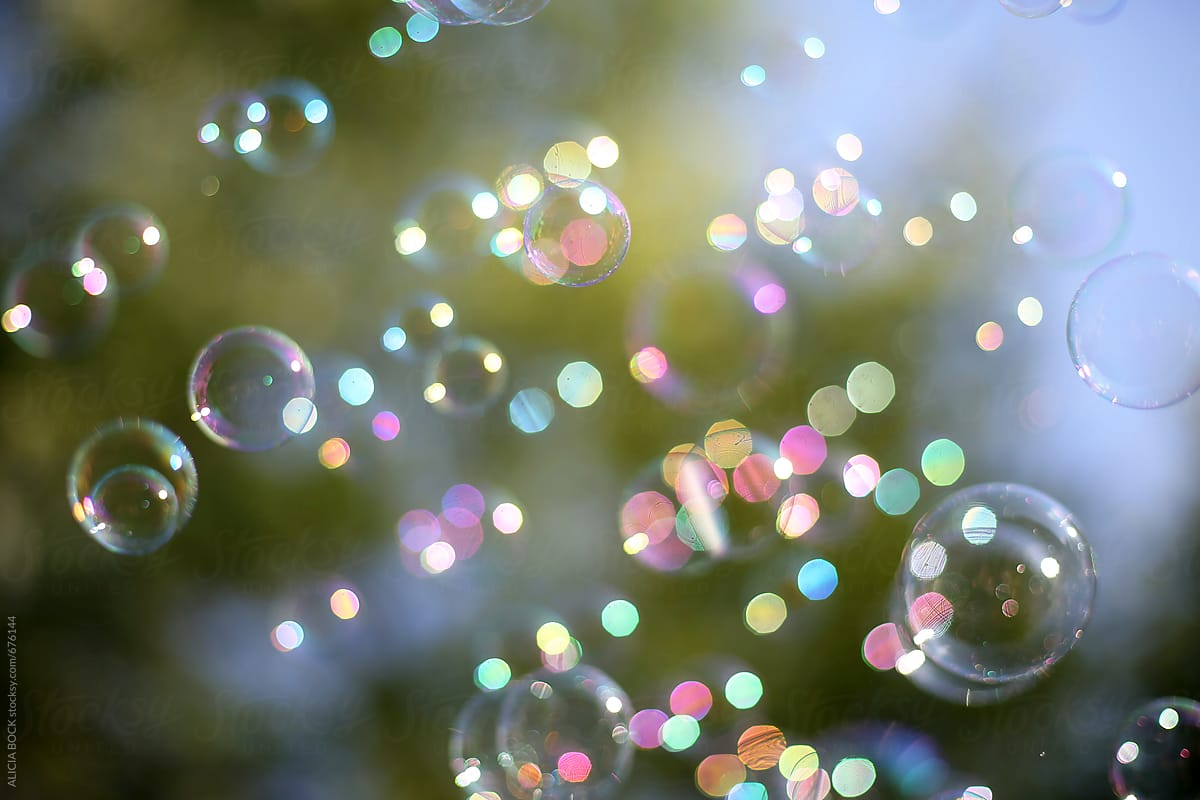 Bubbles And Colorful Bokeh Against A Summer Sky