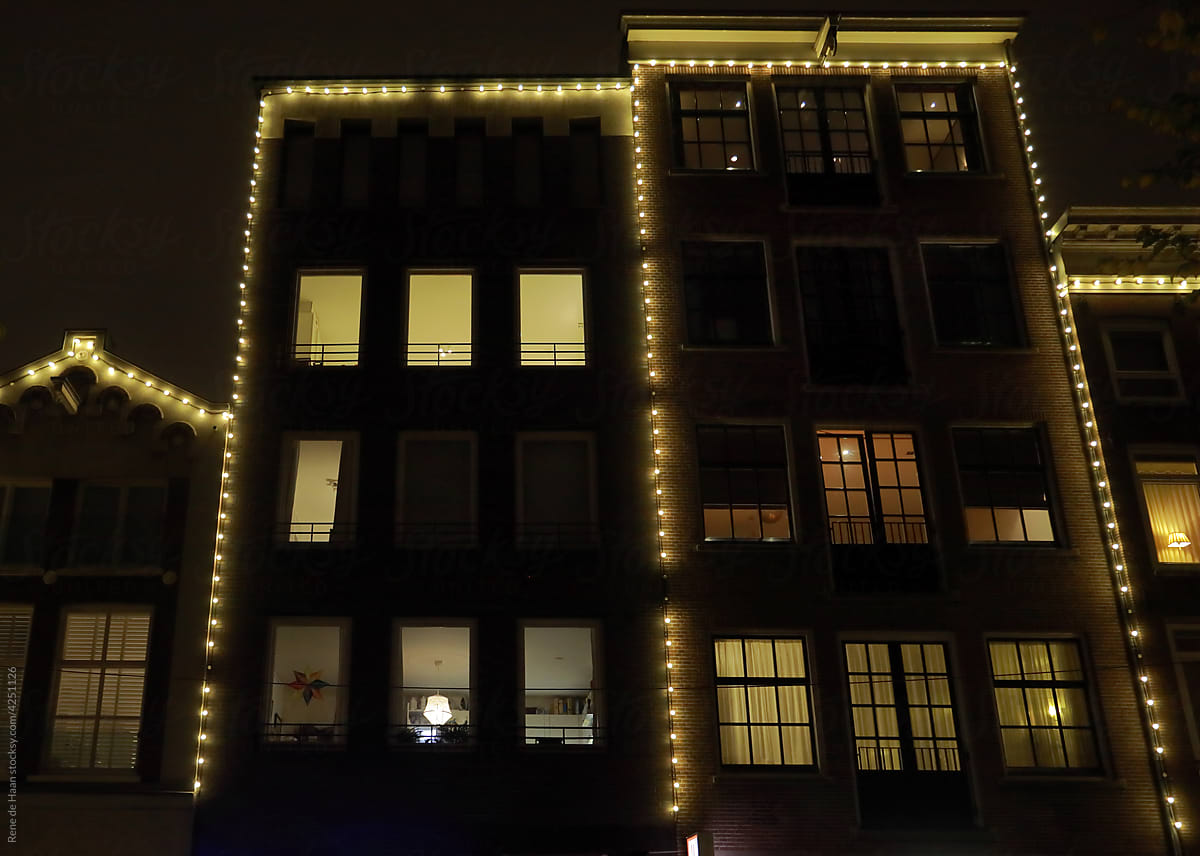 facades of houses in Amsterdam at night