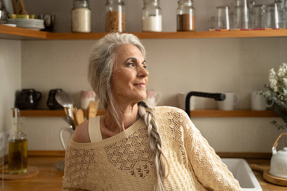 Happy retired woman at home portrait
