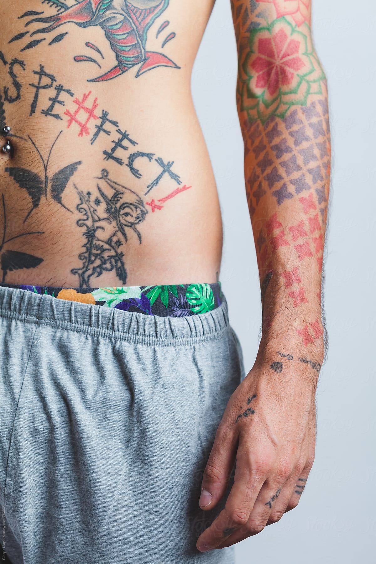 Many Tattoos On The Body Of A Young Man