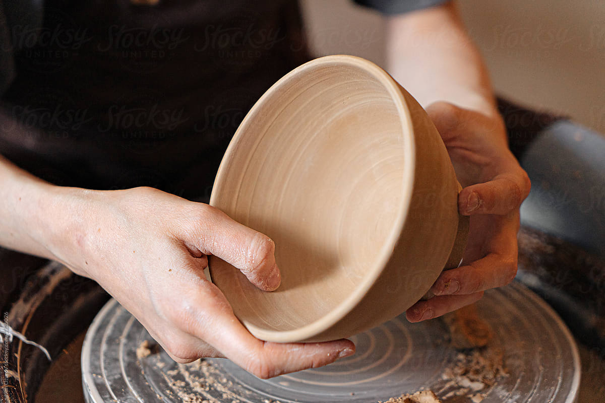 making a cup from clay
