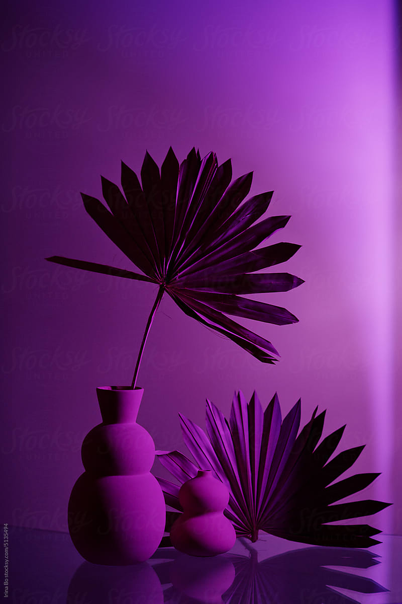 Vases with palm leaves