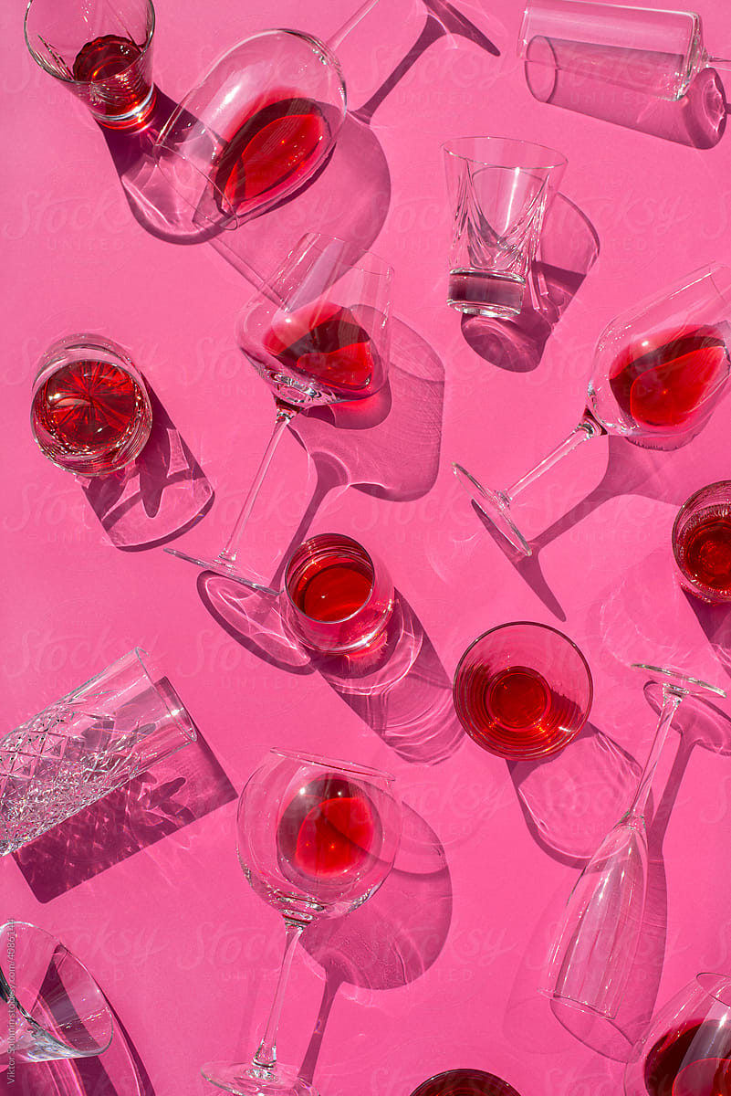 Set of glassware on pink surface