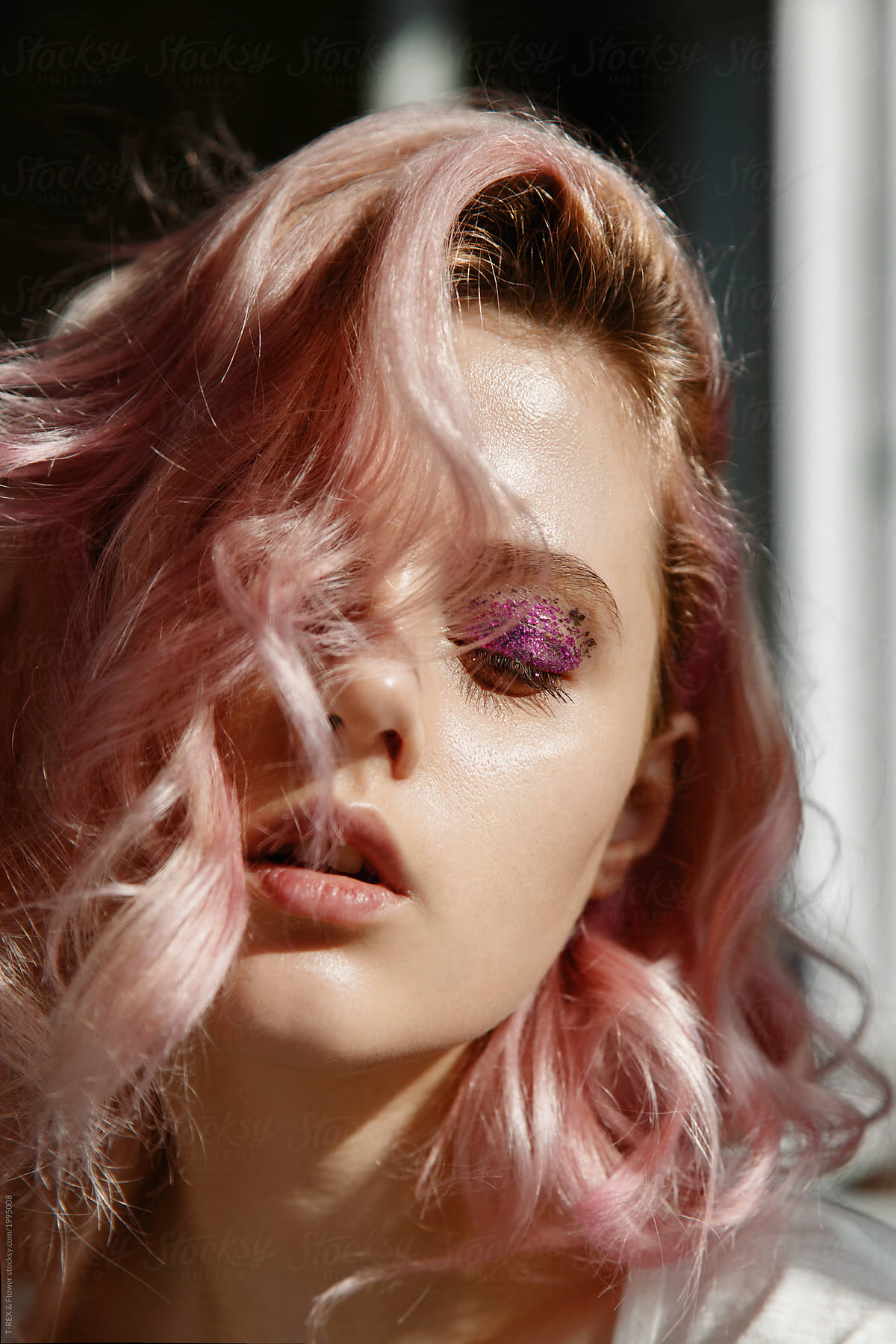 beautiful-blond-woman-with-glitter-eye-make-up-by-stocksy-contributor