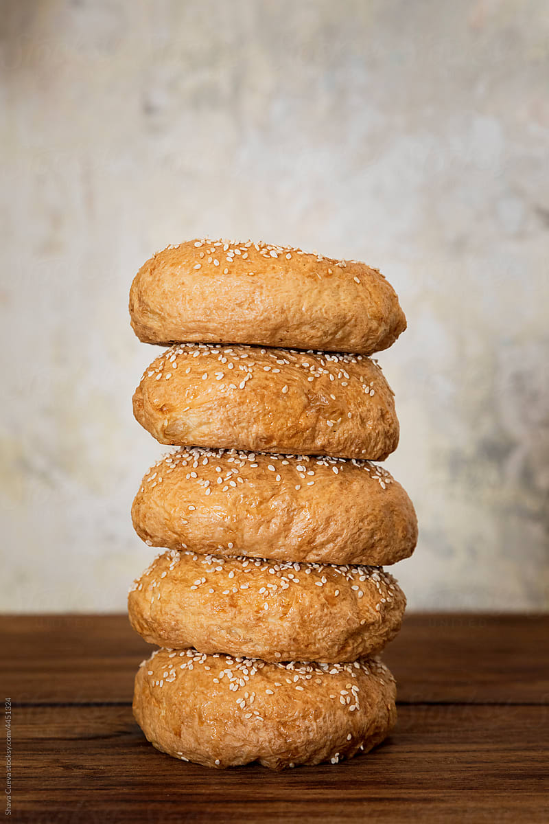 stacked bagels on a wooden table
