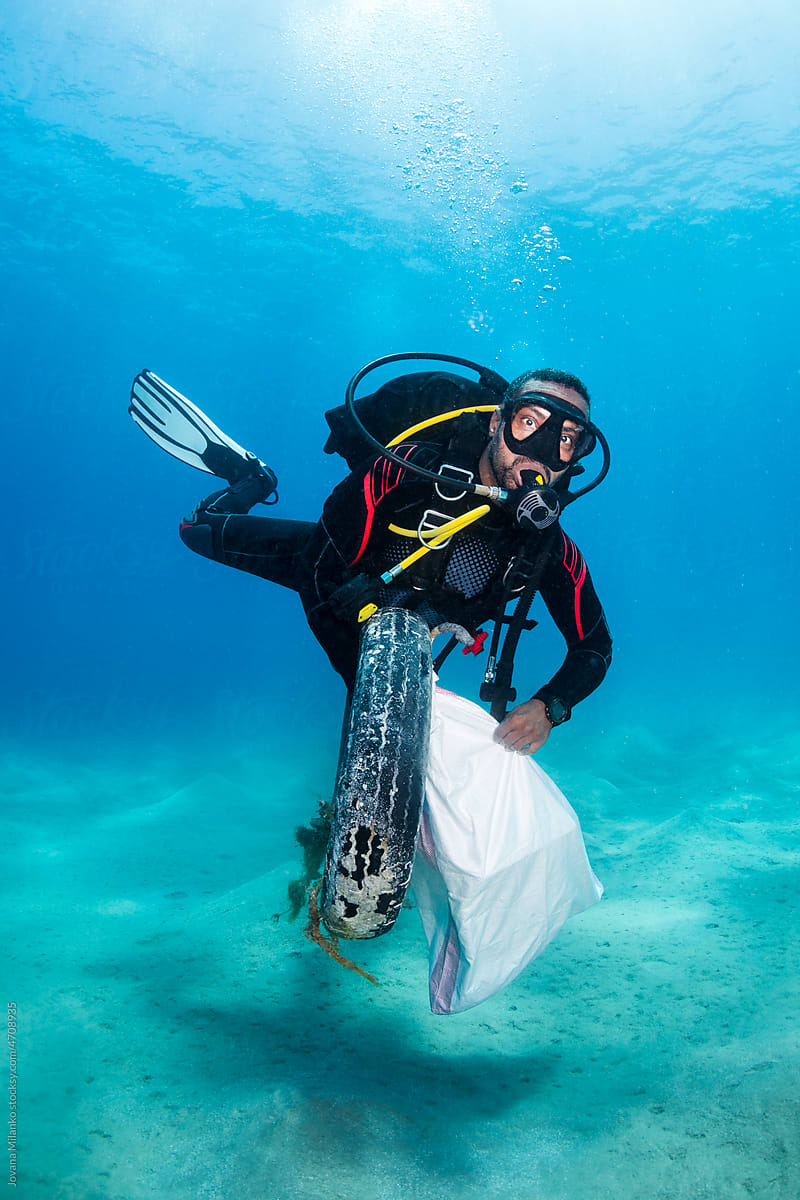 Man Removing Trash from the Ocean