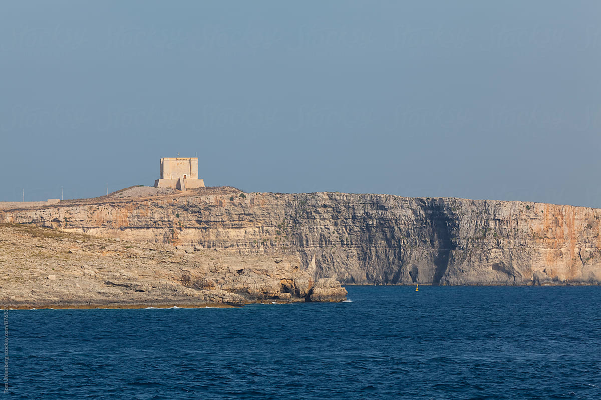 Comino, Malta - Limestone Cliff with a Watchtower on the Maltese Coast