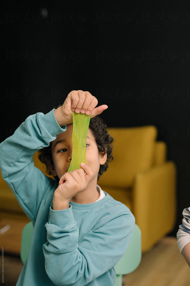 Boy playing with slime