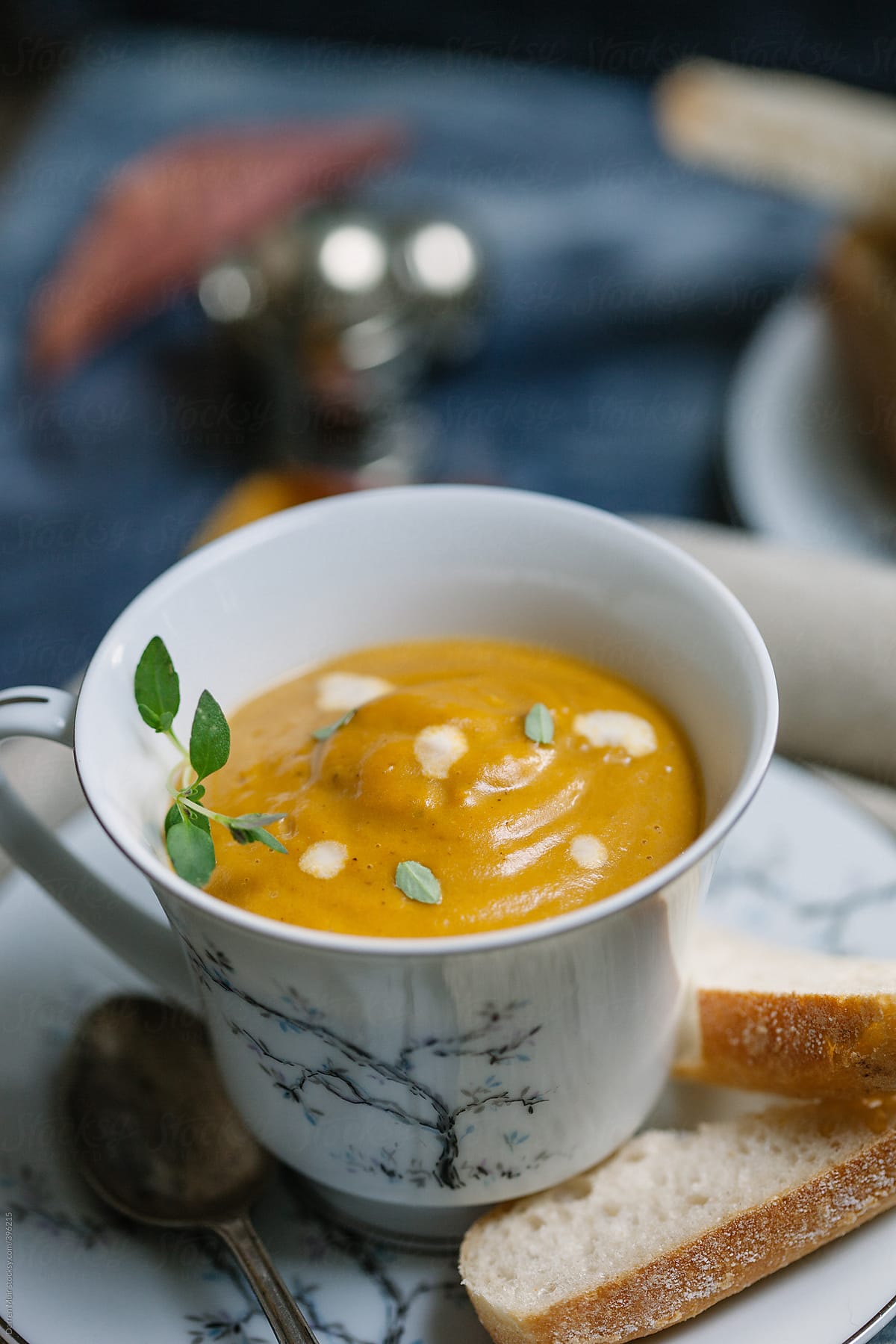 Teacup of pumpkin soup.